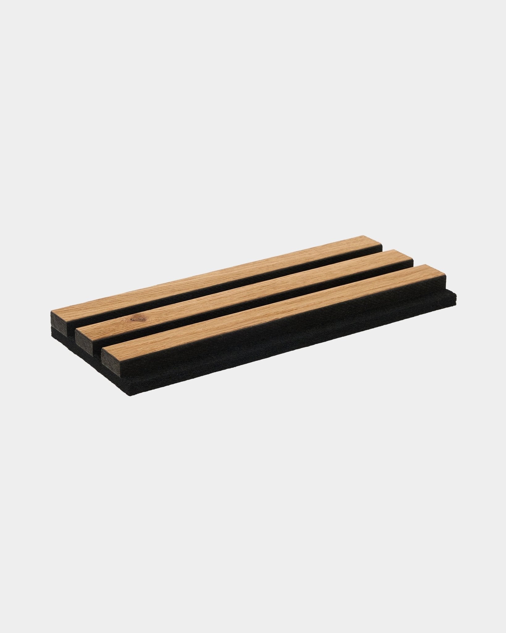 Akupanel sample of brown oak slats on black felt shown on plain white background