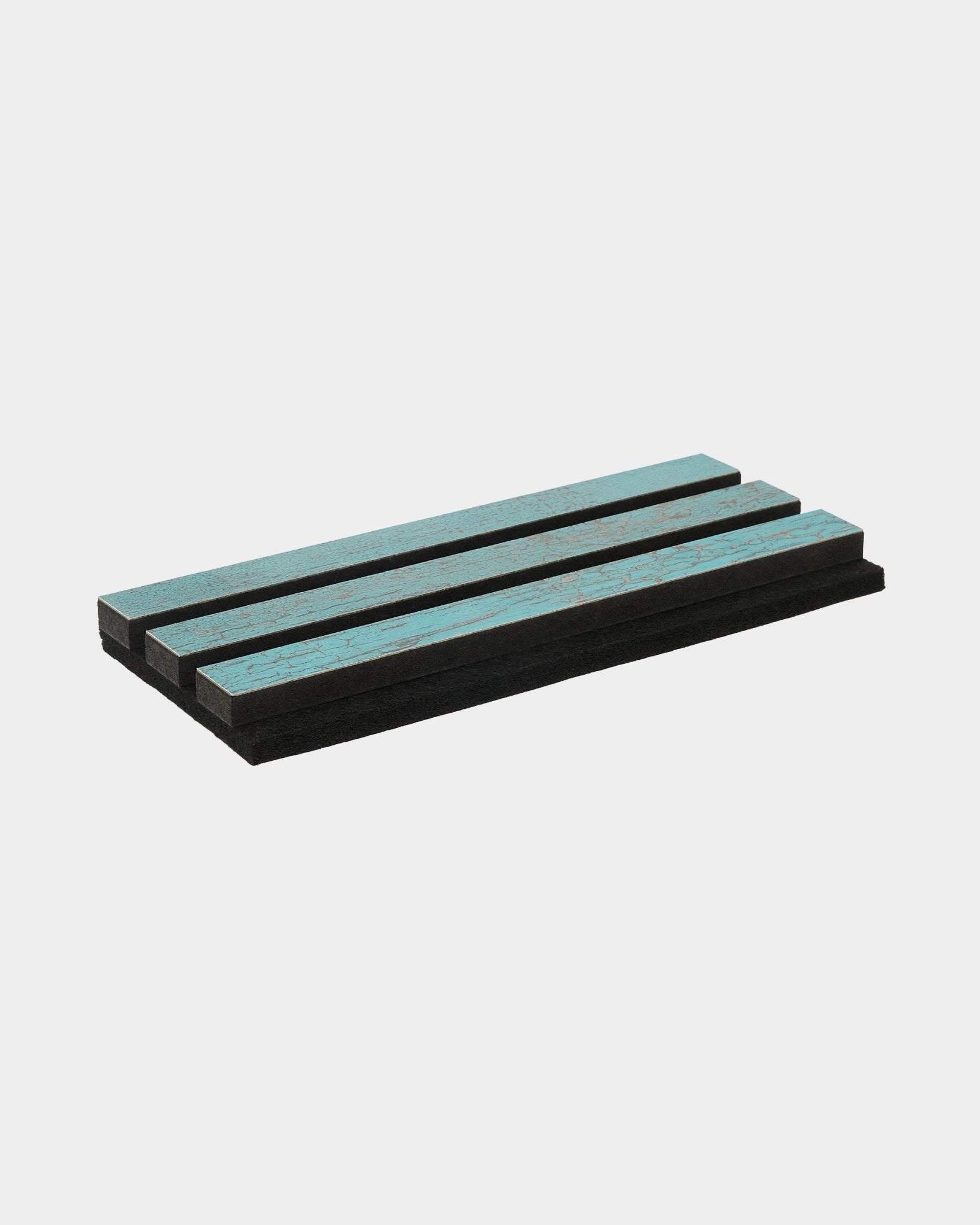 Akupanel acoustic slat panel sample in oxide blue on a plain white background