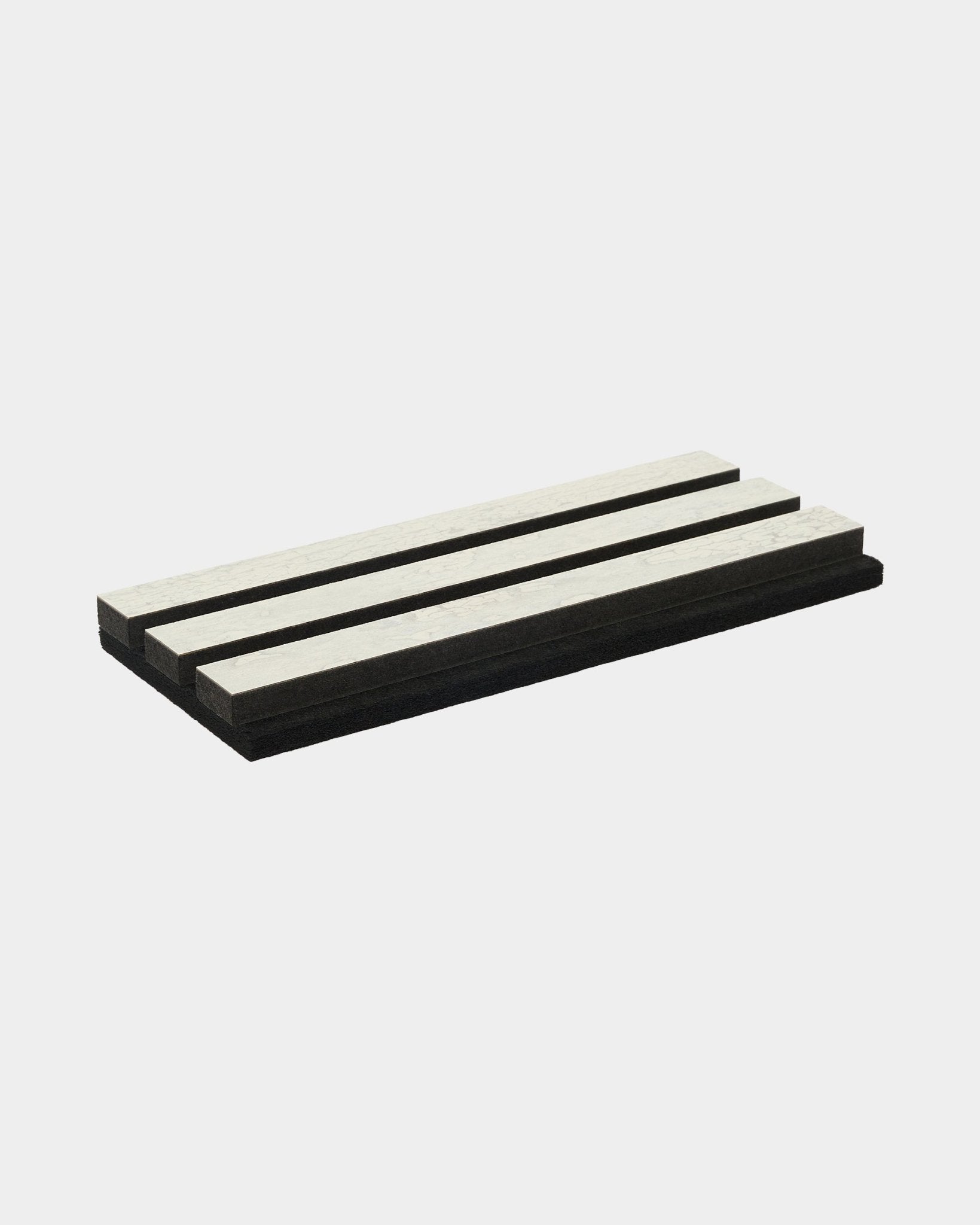 Akupanel acoustic slat panel sample in White Oxide finish on black felt on plain white background.