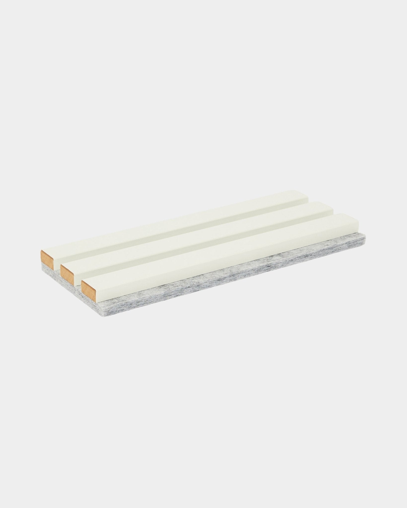 Akupanel white acoustic slat sample on grey felt backing on plain white background
