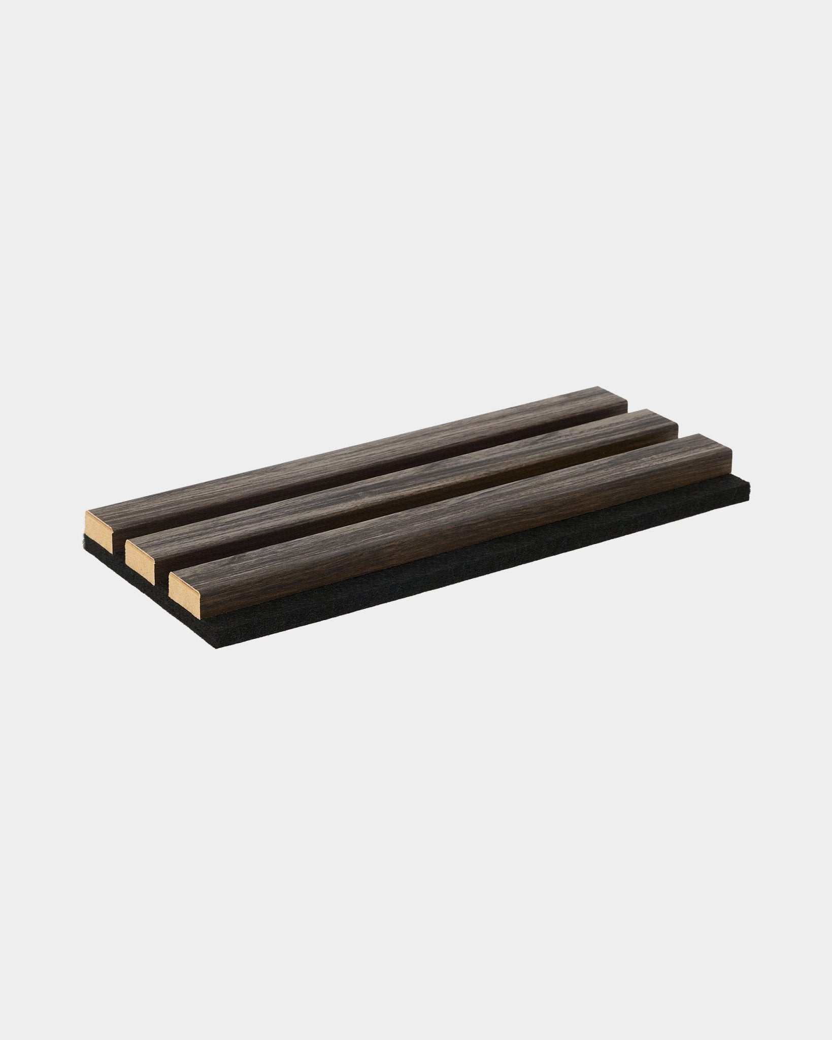 Black Oak Akupanel acoustic slat panel sample on plain light grey background