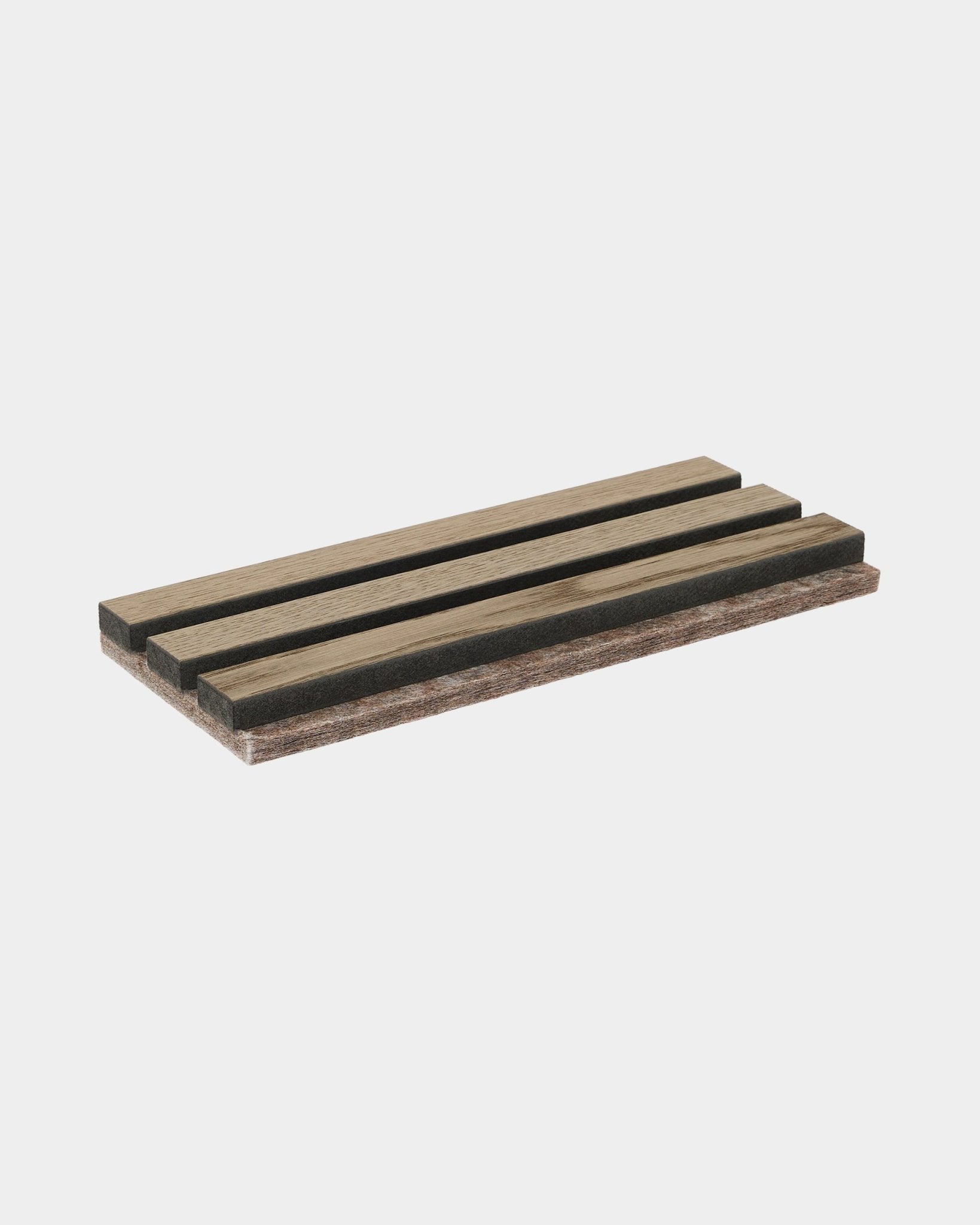 Akupanel acoustic slat panel sample in Grey Oak on plain light grey background