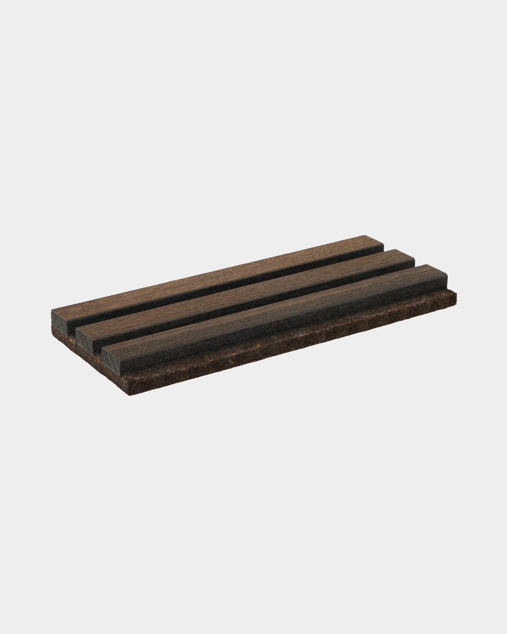 Akupanel Tonal acoustic slat panel sample in dark smoked oak on a plain light grey background