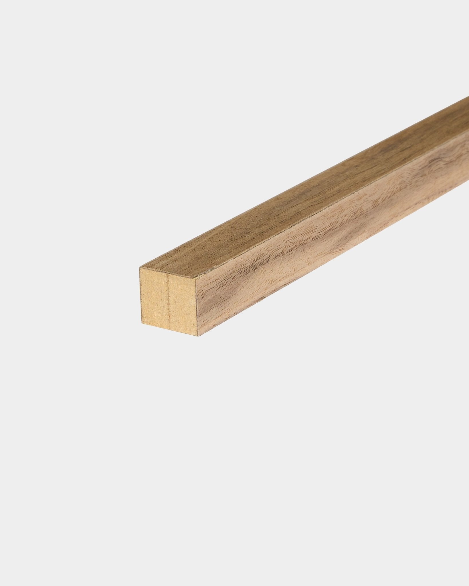 End lamella slat, walnut finish, on a plain white background