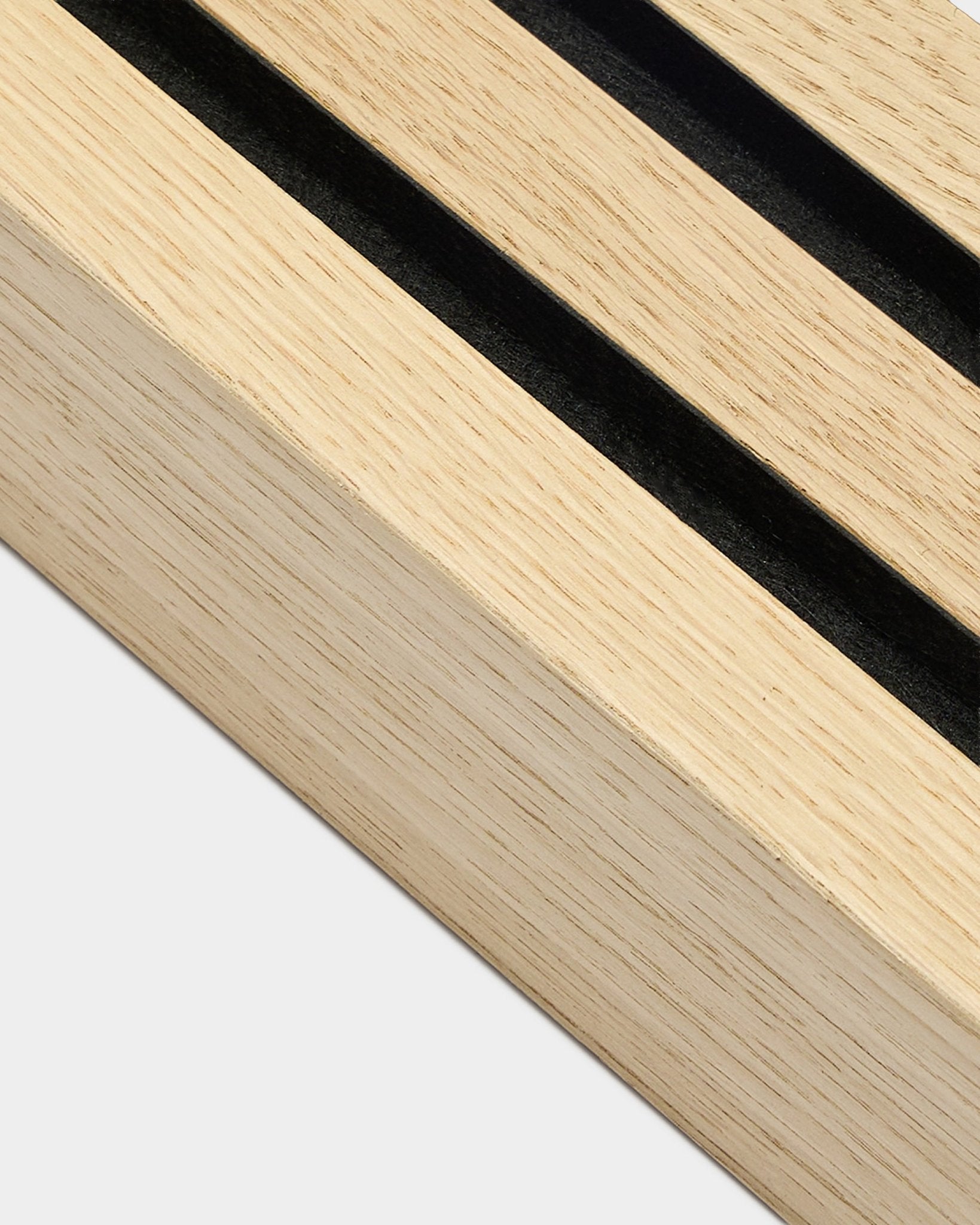 Akupanel end lamella in oak with black acoustic felt backing on plain grey background