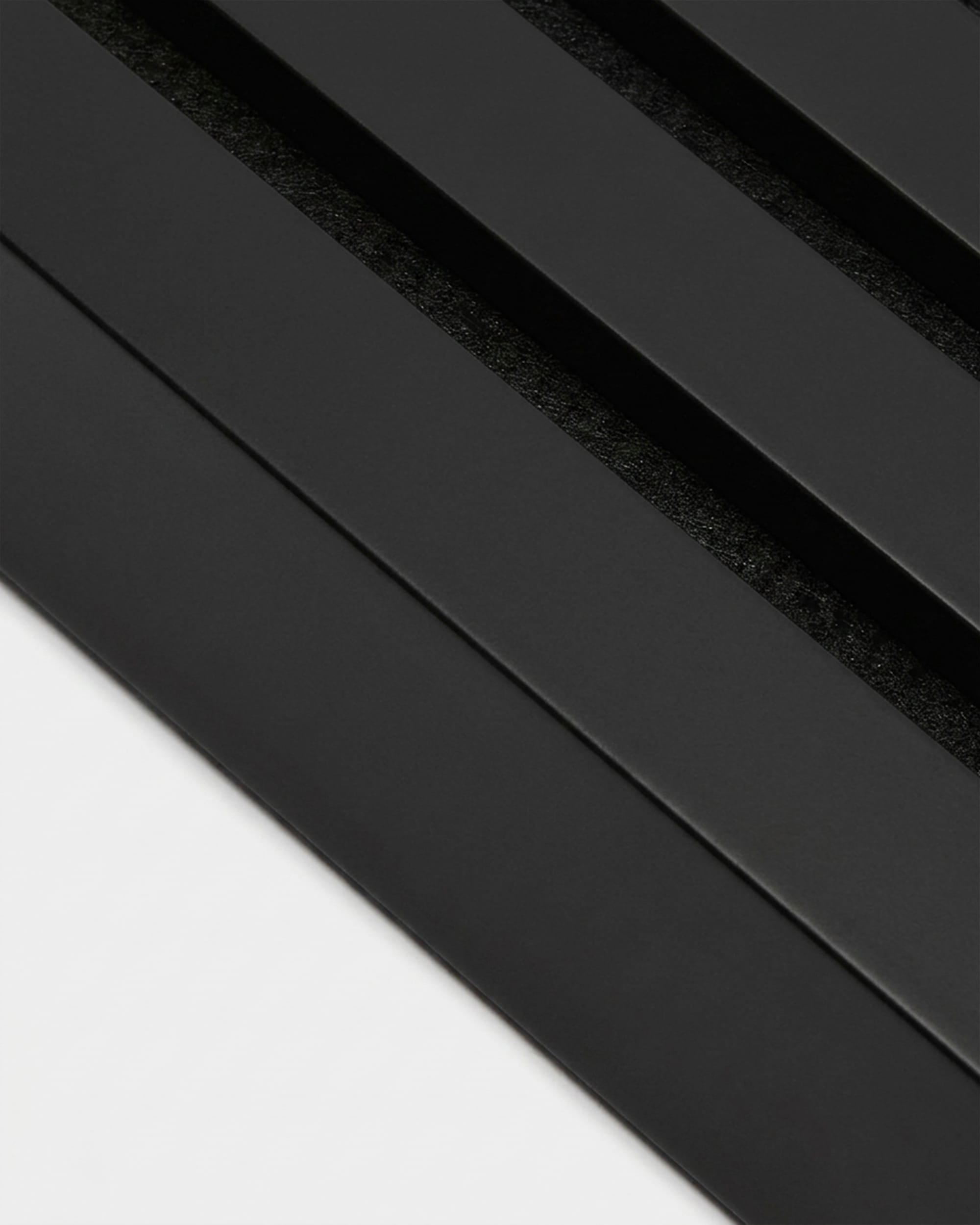 Black end lamella, 240 x 6.7 cm, for Akupanel or MDF panel edging; features parallel slats with dark gaps on a light background.