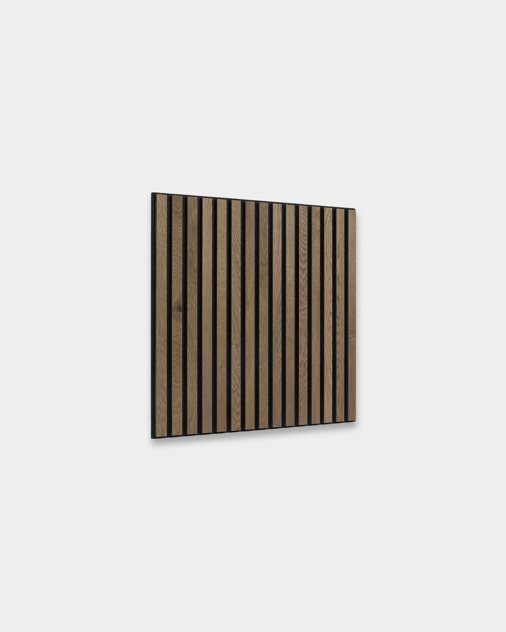 Akupanel acoustic slat wall panel in grey oak with black felt backing on a light grey background