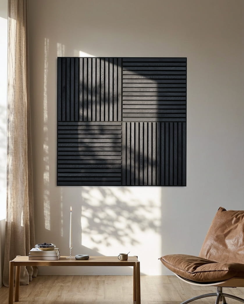 Akupanel black acoustic slat wall panel on pale wall in a sunlit room.