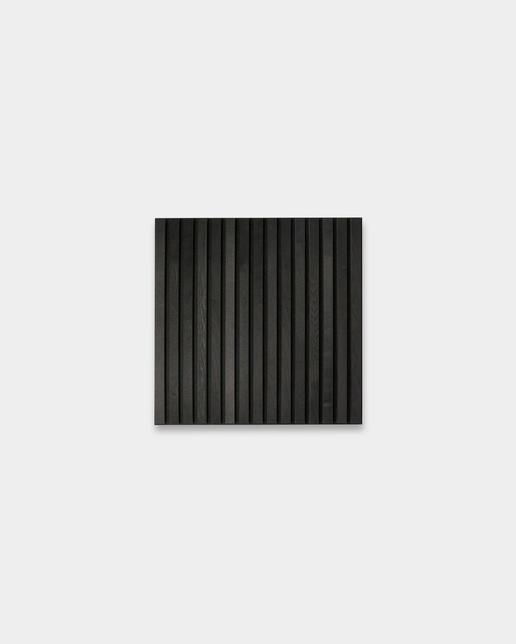 Akupanel black acoustic slat wall panel with vertical slats on plain light grey background