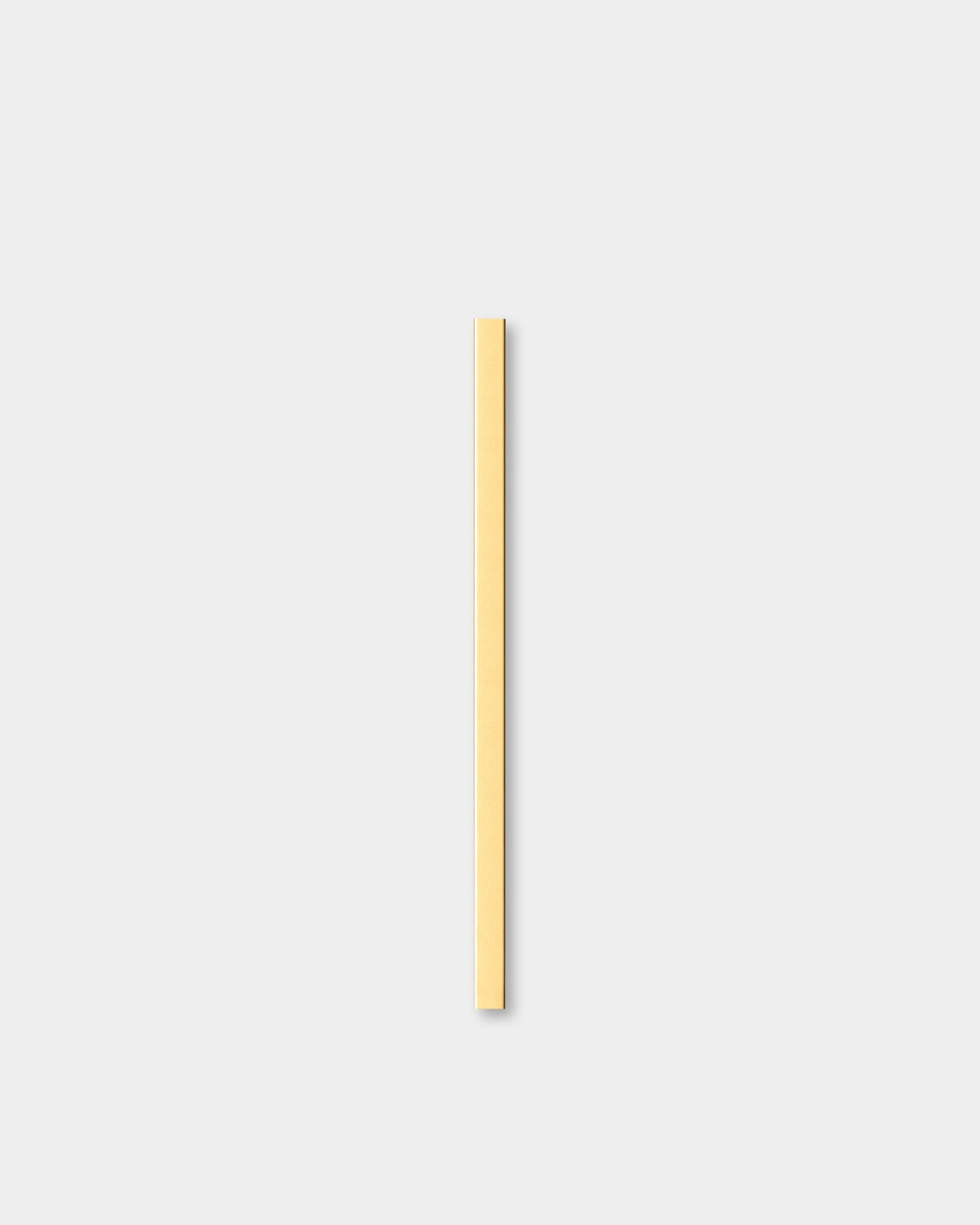 Liva cover profile, brass finish, shown on a plain light gray background