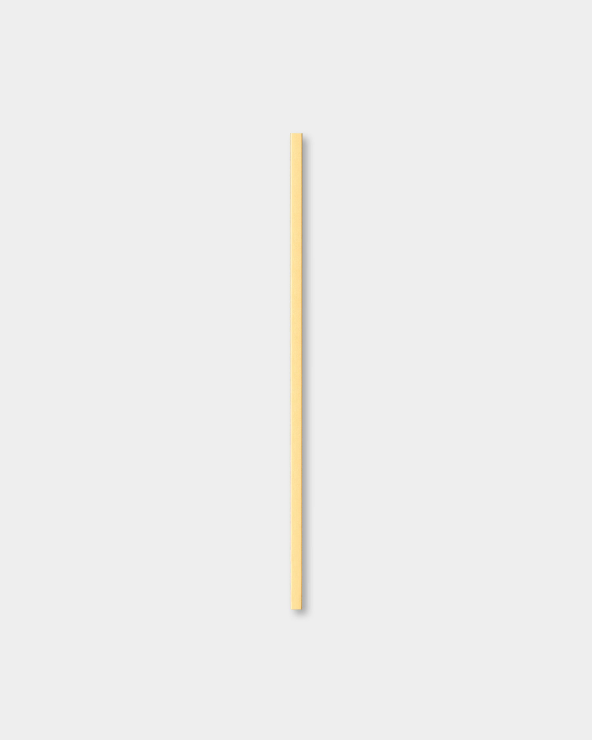 Liva cover profile in brass finish shown on a plain light gray background