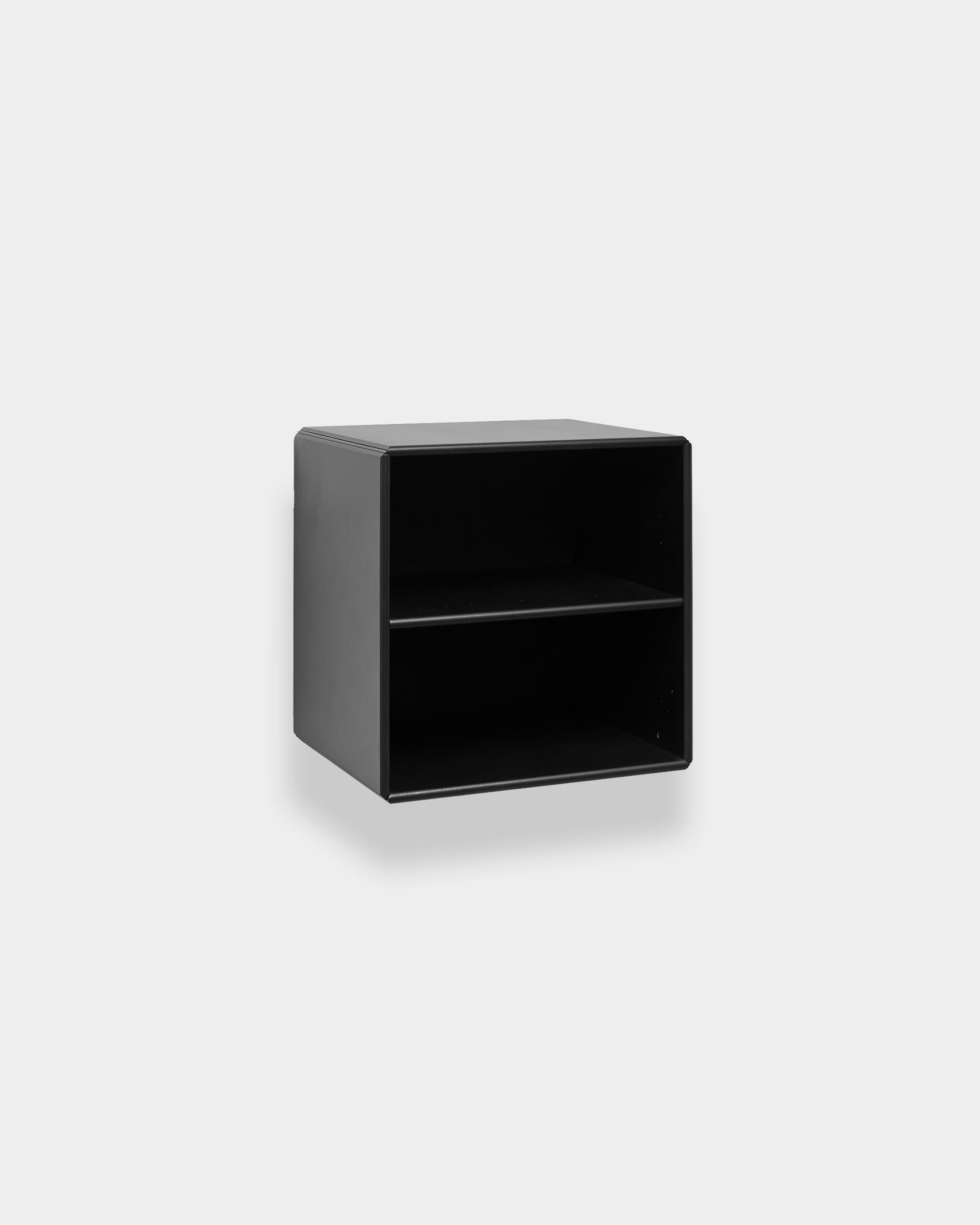 WoodUpp Arka Bookcase in black with two open compartments, modular and wall-mounted, displayed against a light gray background.