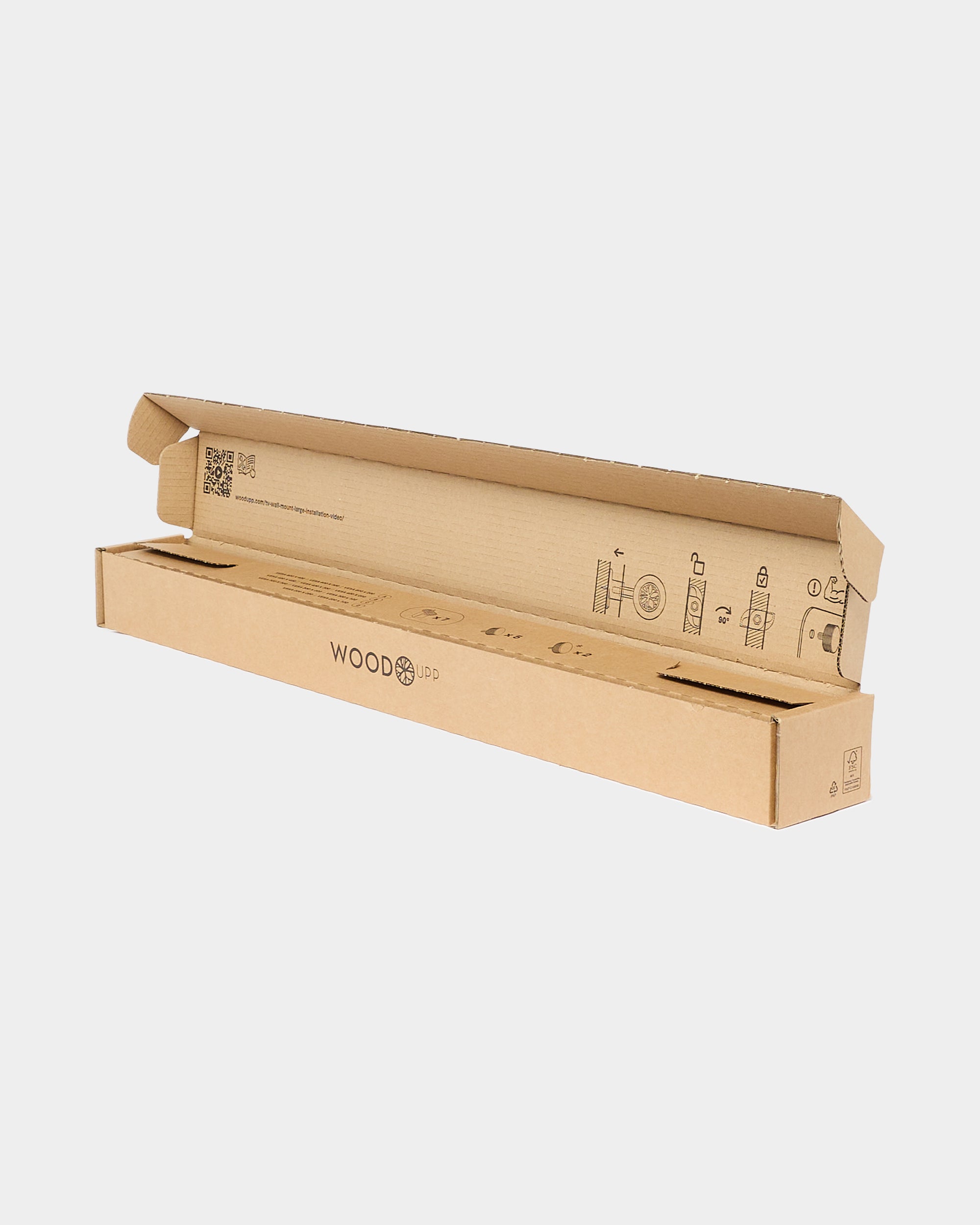 Open WoodUpp cardboard box with printed assembly diagrams on plain white background