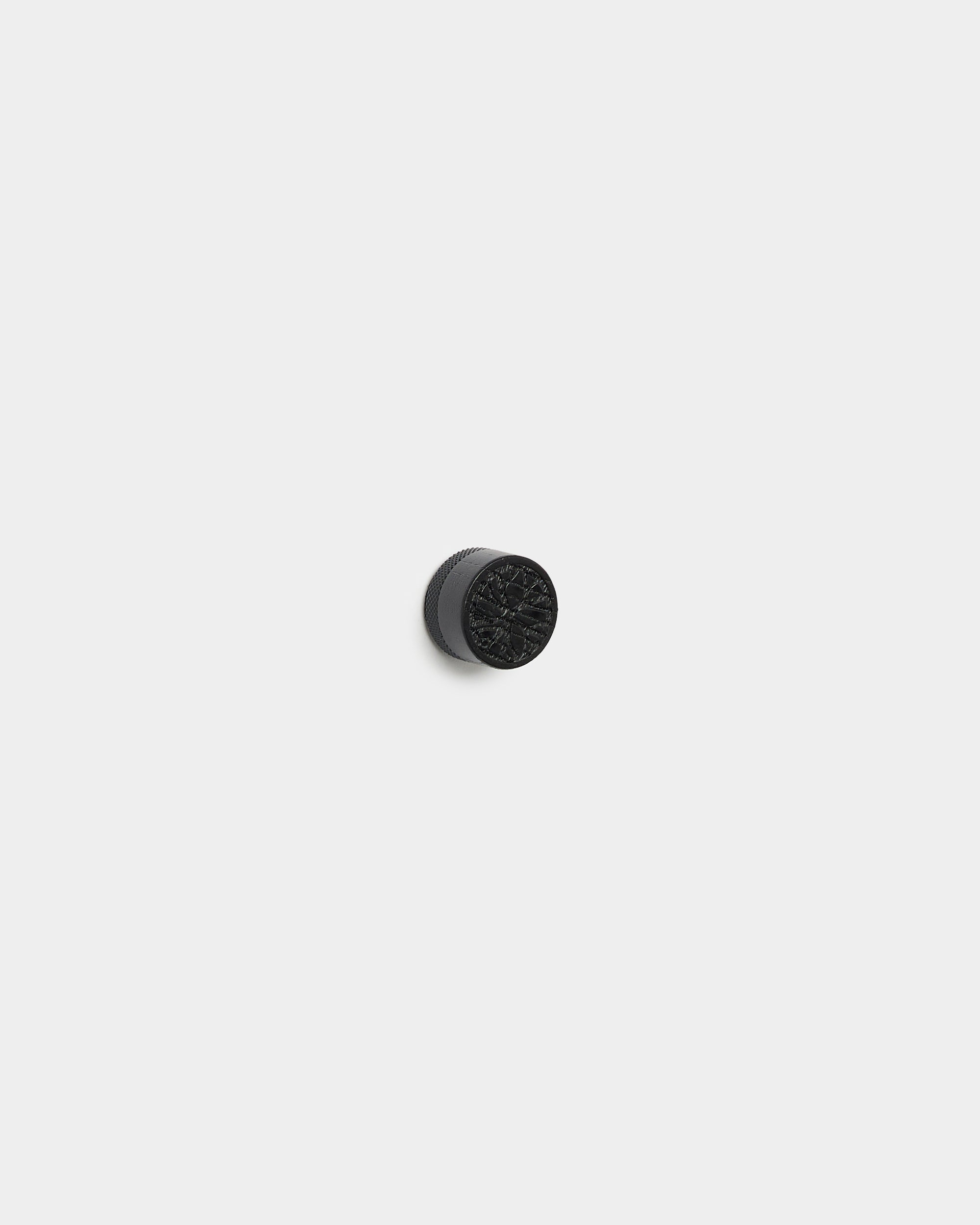 Black Norr poster magnet knob shown on a plain light gray background
