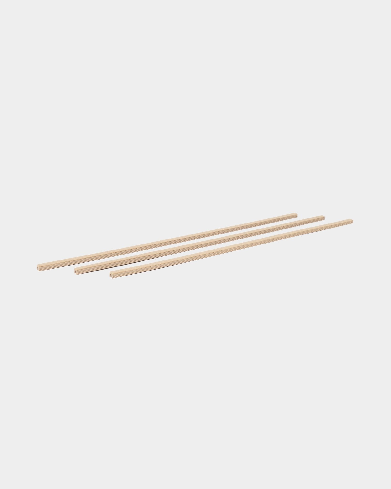 Dupps Pop-on cable covers, beige finish, four pieces on a plain white background.