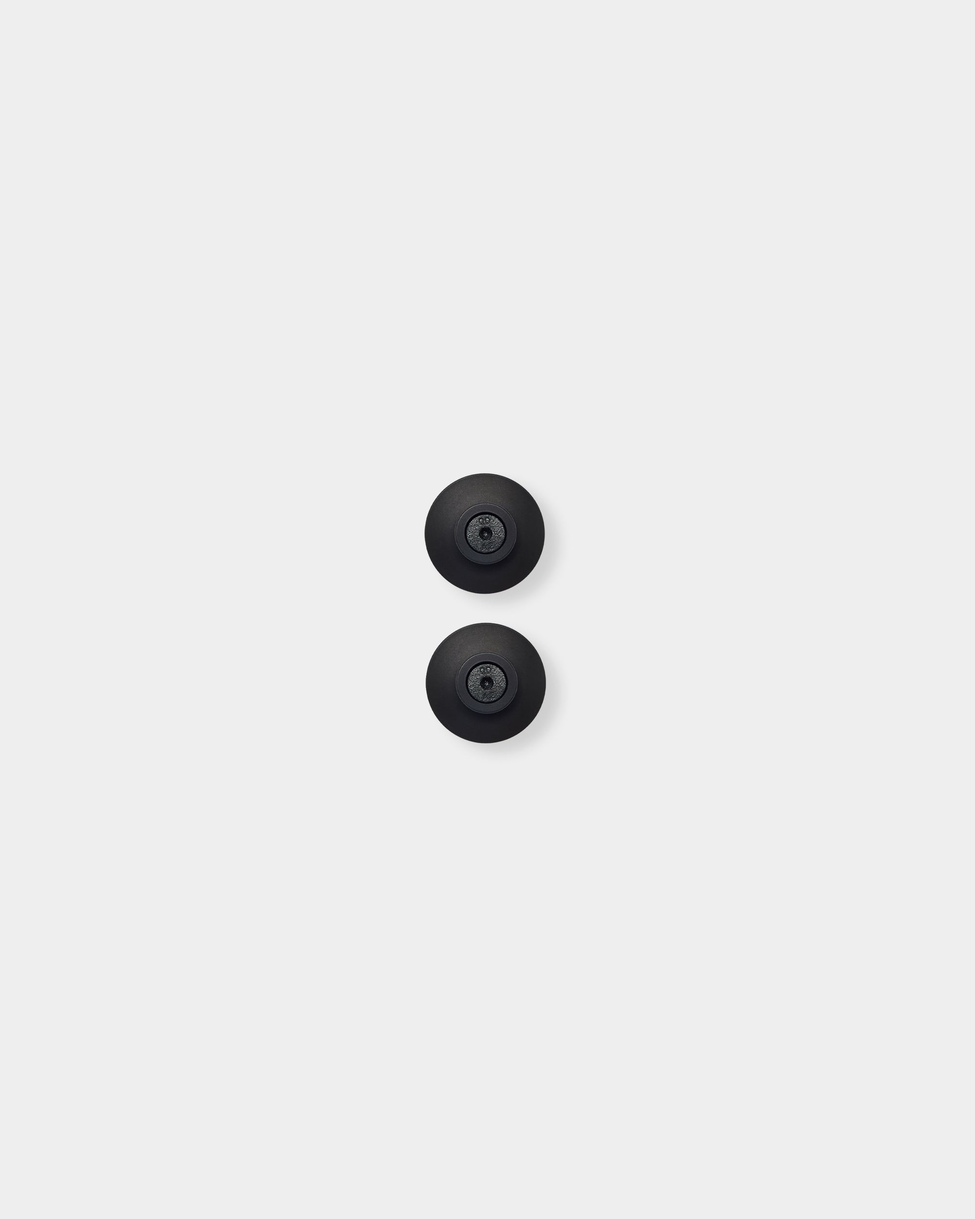 Two black Dupps wall mounts shown vertically on a plain white background