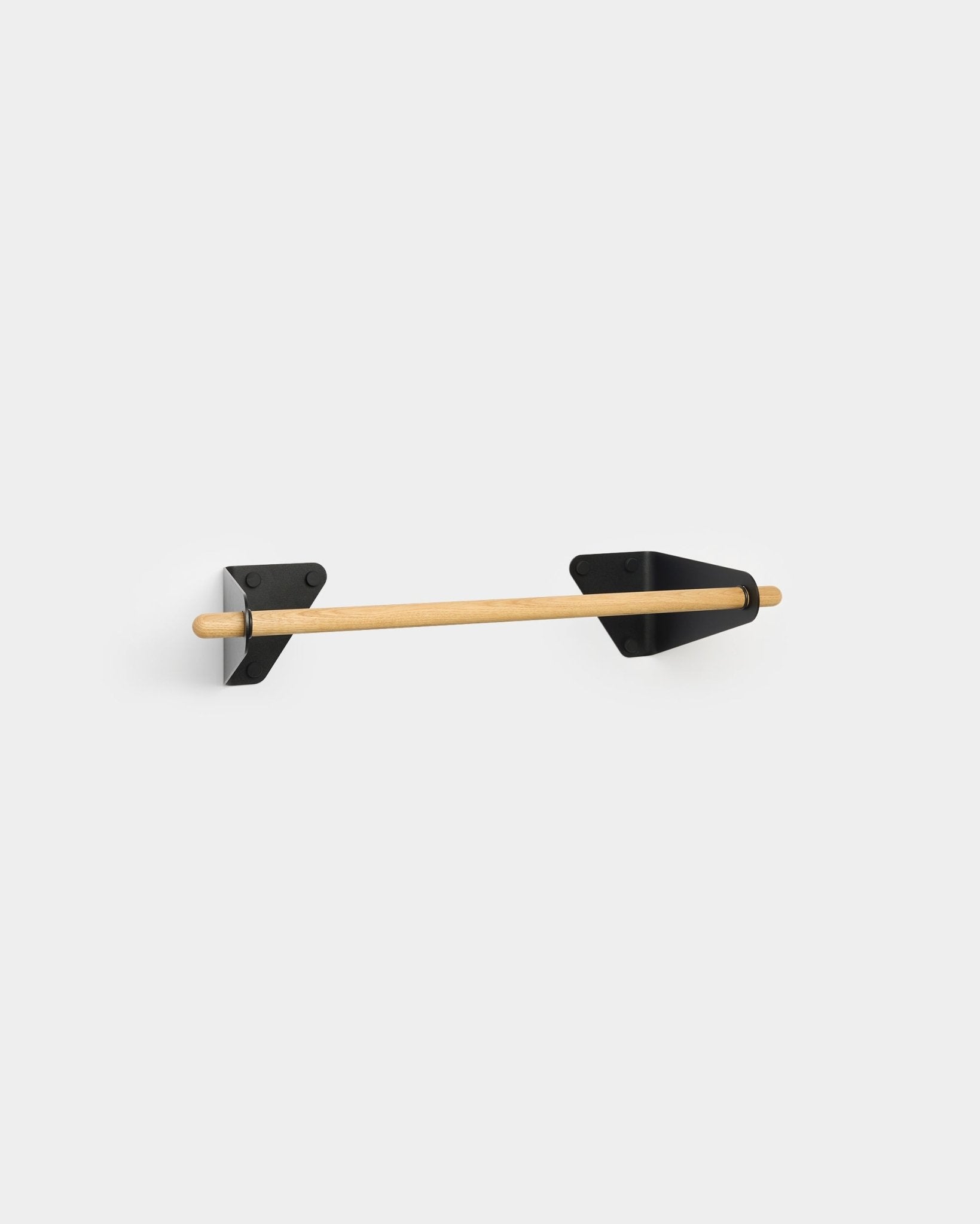 Linn coat rail with wooden rod and black metal triangular wall brackets on plain white background