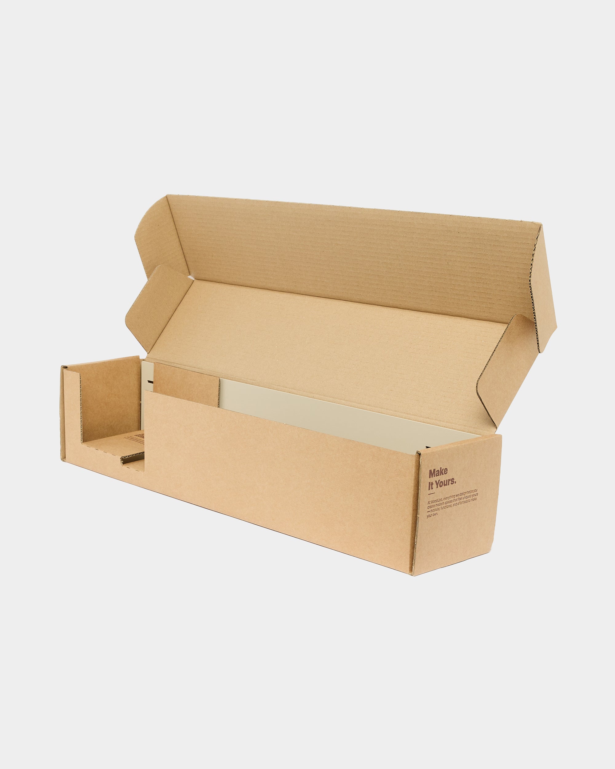 A plain, open cardboard box with flaps extended on a white background, suitable for packing or shipping Akupanel acoustic panels from WoodUpp.