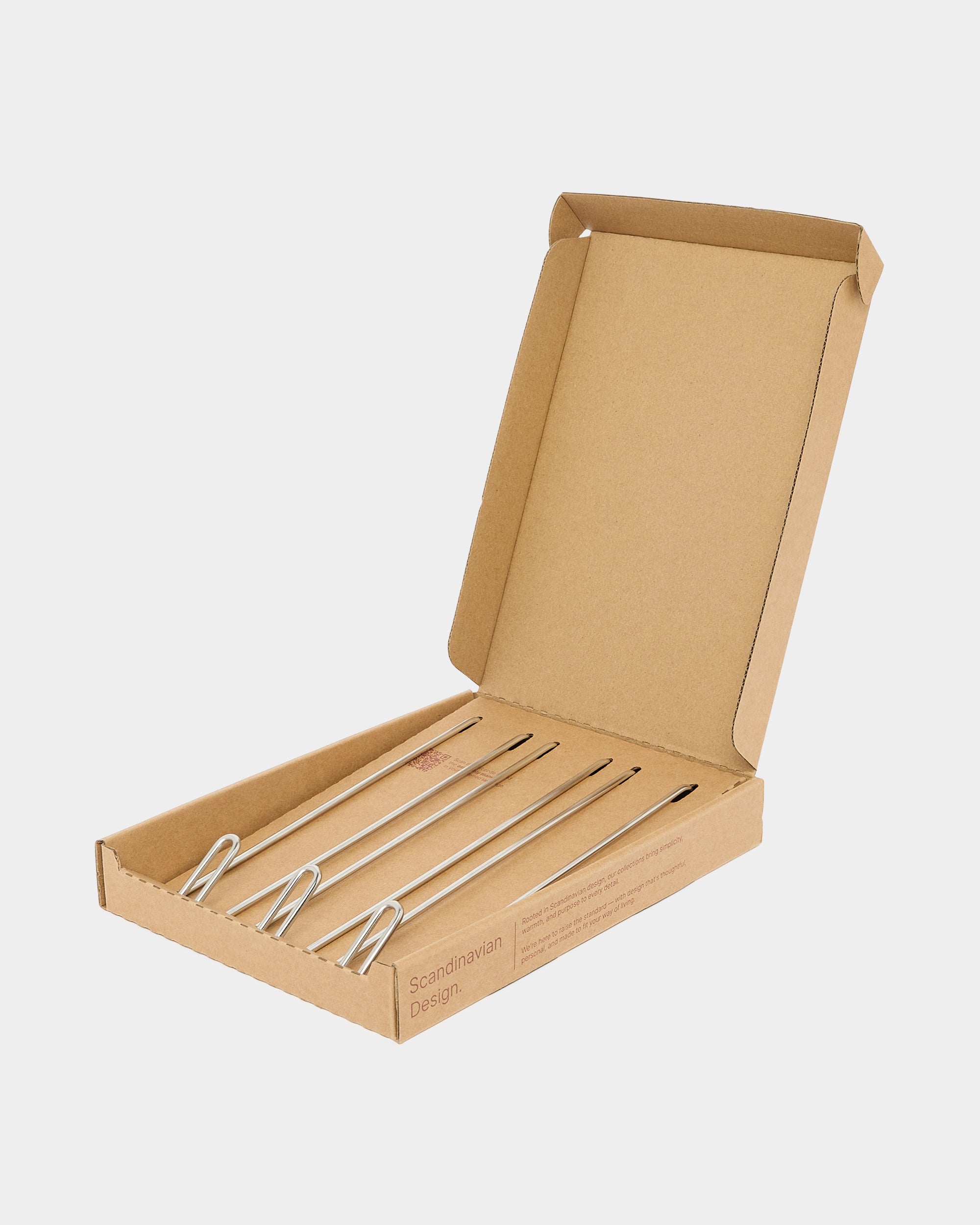 Stainless steel long wire hooks in brown cardboard packaging on plain white background.