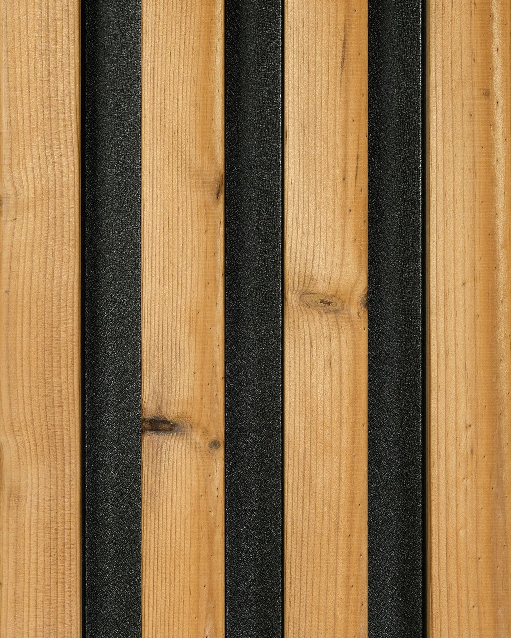 Akupanel acoustic slat wall panel with natural wood slats and black felt backing