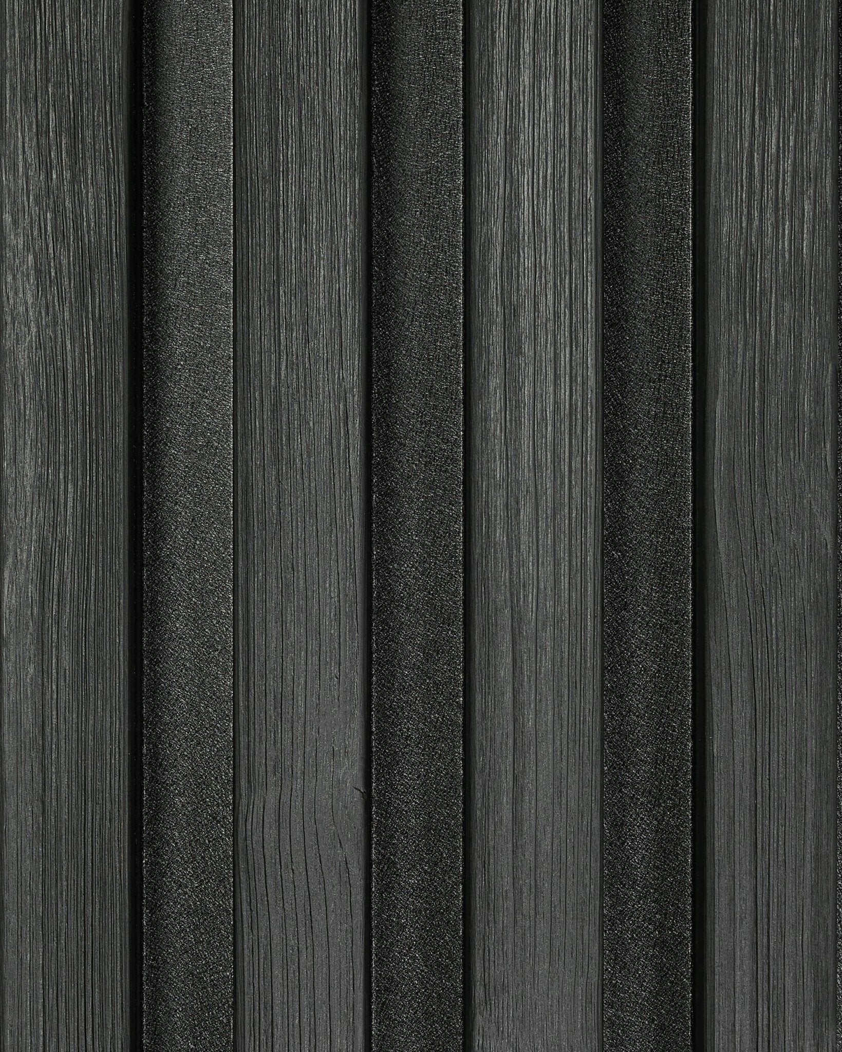 Black Akupanel acoustic slat wall panel close-up with visible black felt backing