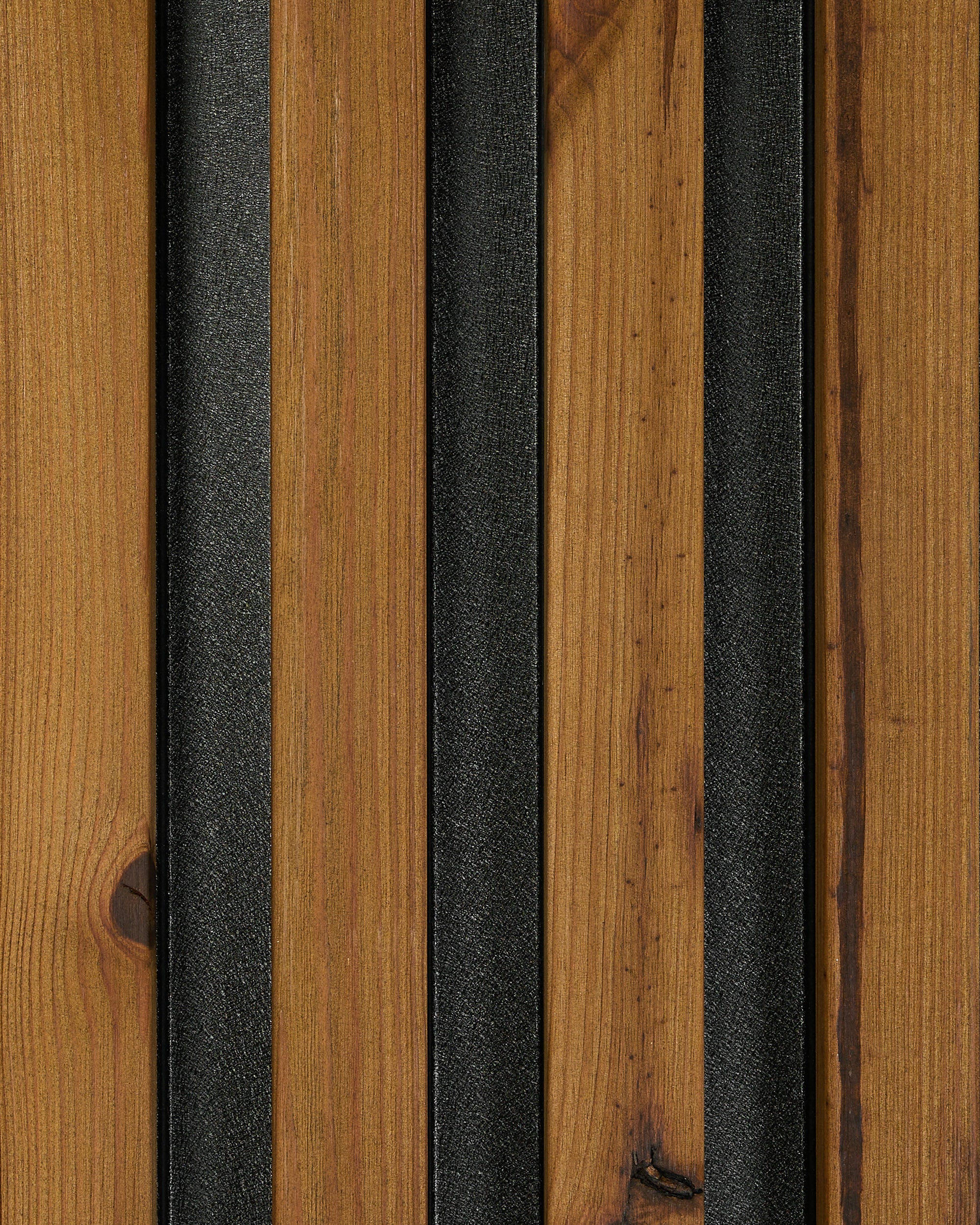 Akupanel wood slat panel with brown wood slats and black acoustic felt backing