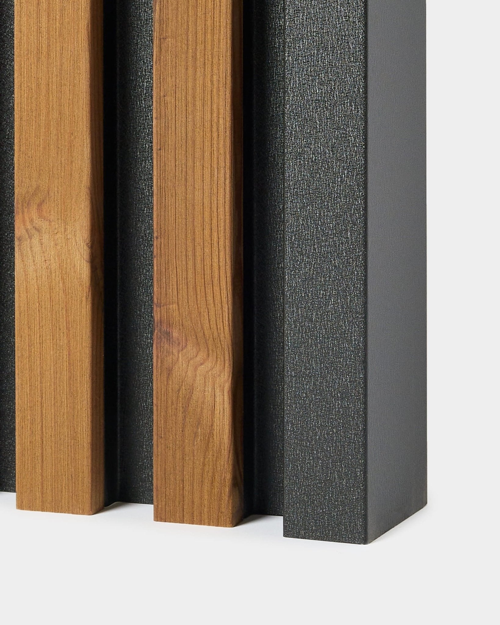 Akupanel wood slat acoustic wall panel end corner with vertical wood slats on black felt backing