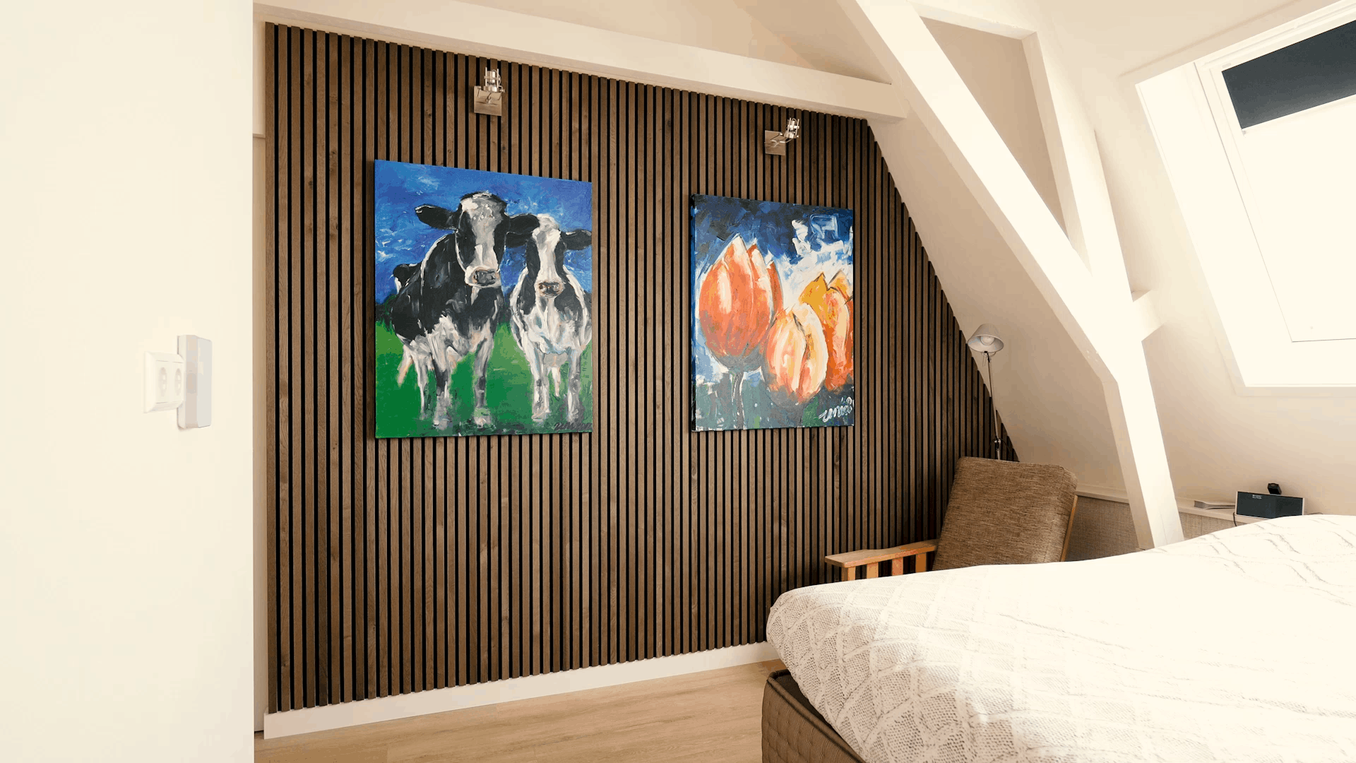 Dark wood Akupanel acoustic slat wall panels on black backing in a bedroom under eaves.