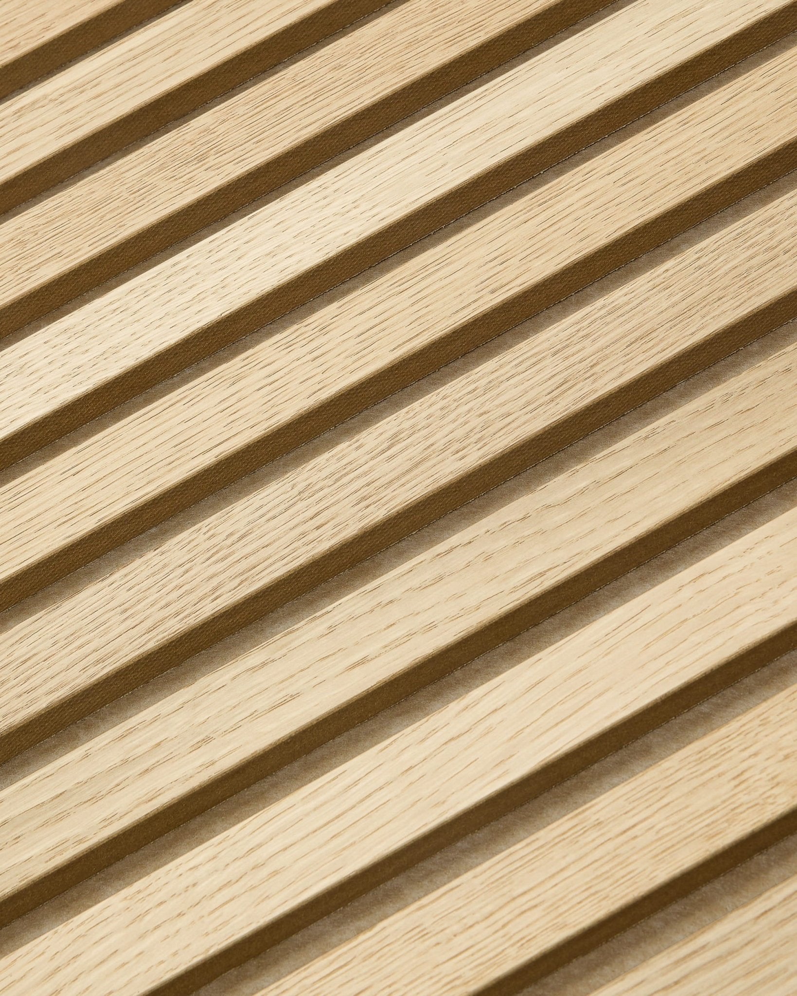 Akupixel acoustic slat panel, Carolina Oak slats with dark-beige felt backing, diagonal close-up.