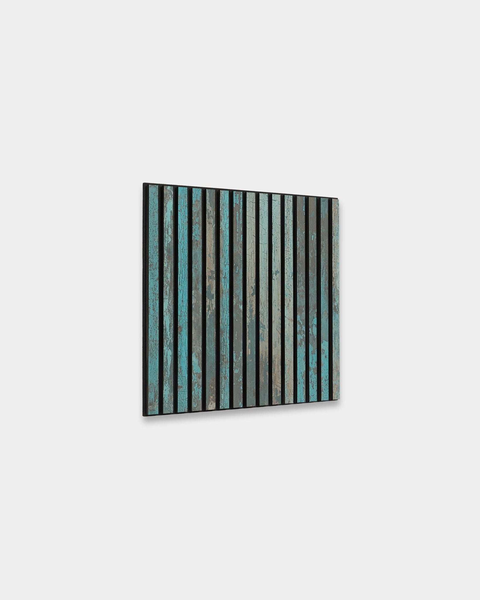 Akupanel acoustic slat wall panel, turquoise distressed finish with black felt, on a plain light gray background