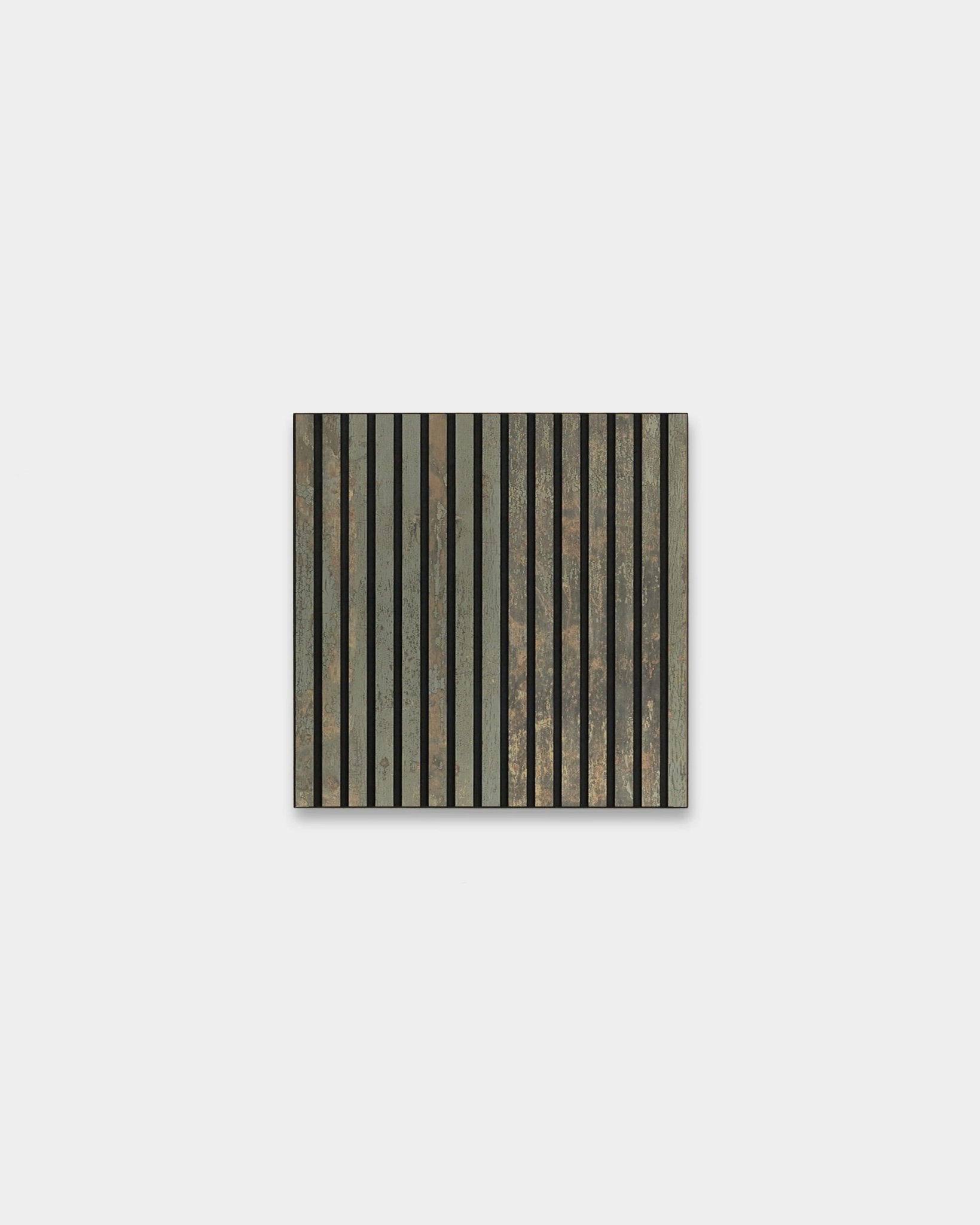 WoodUpp Akupixel acoustic panel in Oxide Grey and Black Felt (60x60 cm) with vertical stripes, mounted on a plain light gray wall for sound comfort.