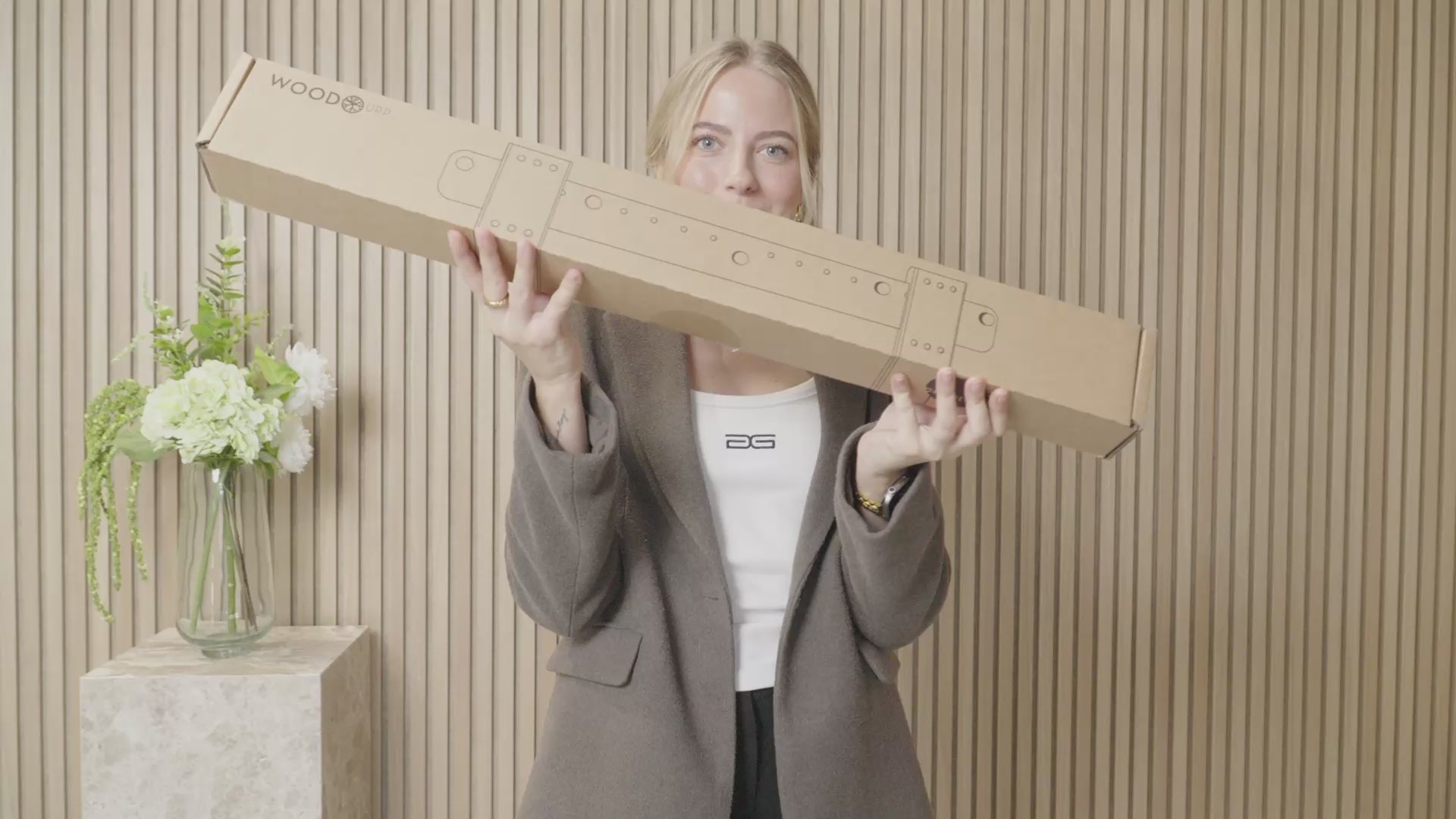 Step-by-step guide to installing the WoodUpp Fjell TV mount for large screens, from unboxing to the mounted bracket.