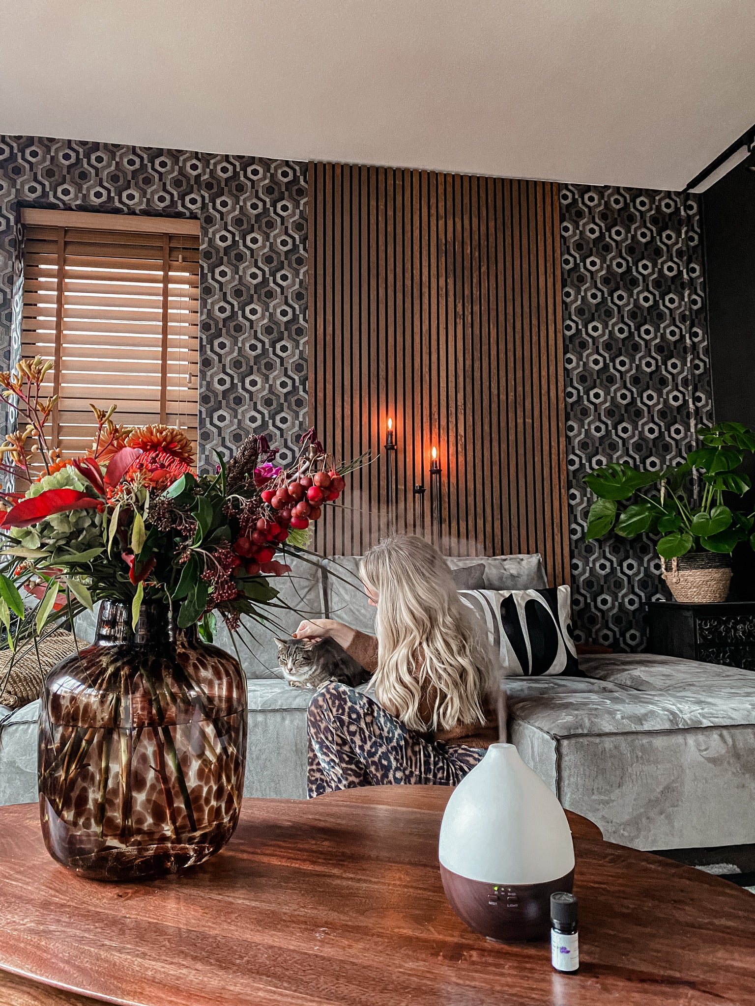 Akupanel acoustic slat wood wall panel on patterned wallpaper in a living room